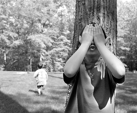 a kid playing hide-and-seek
